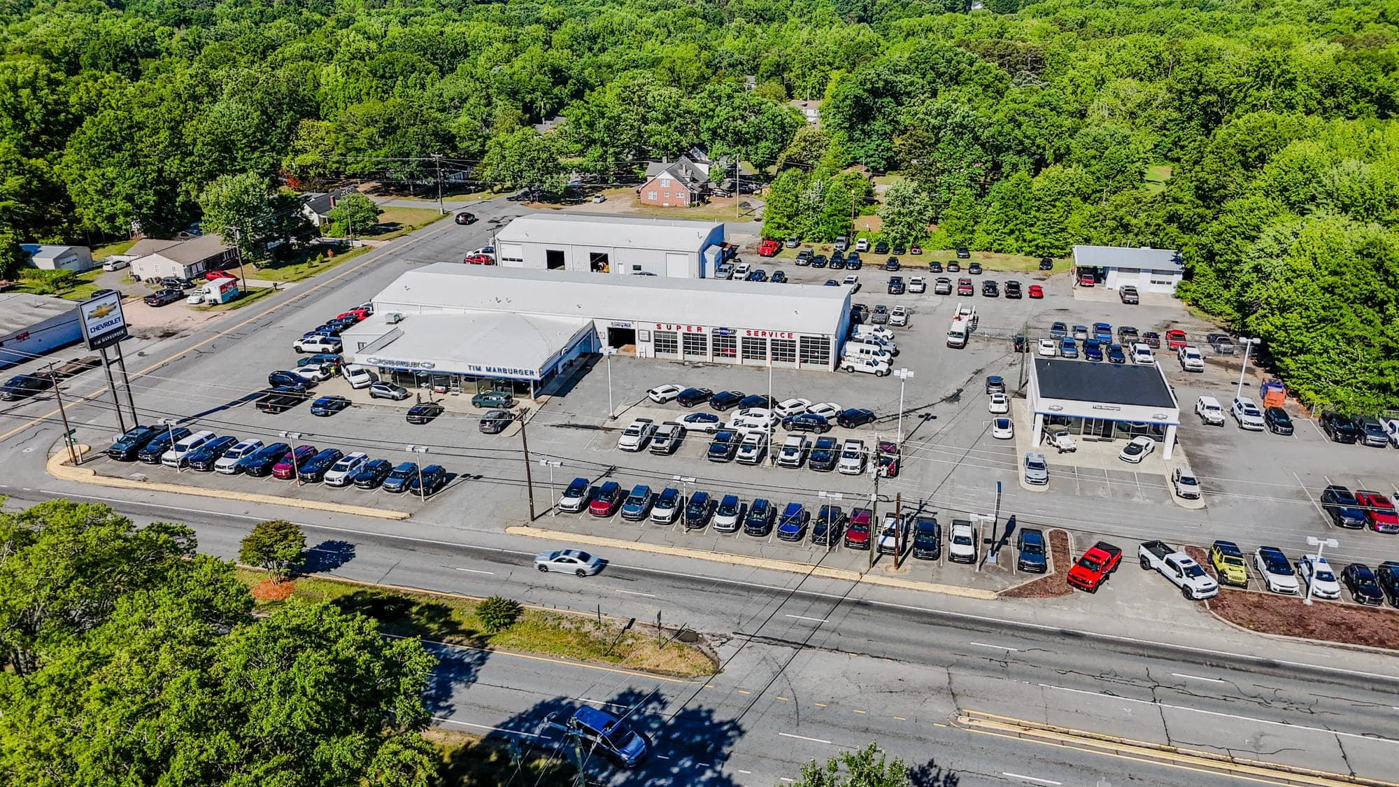 Aerial view of a retail center beside a major highway showing location and access