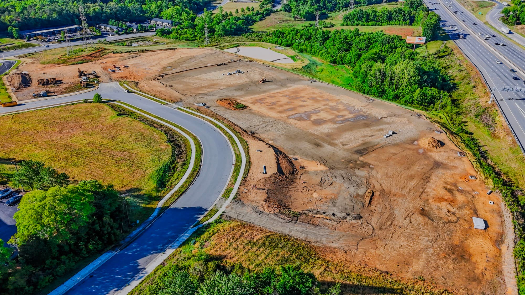 Aerial site-documentation record of an active land development with new roads by SQO SkyWorks, Charlotte NC